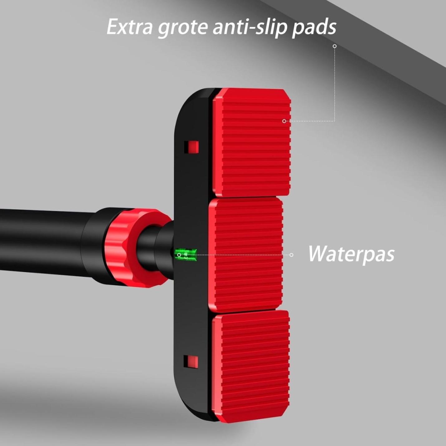 Close-up van een rood en zwart De optrekstang die je thuis een complete workout geeft gemaakt van hoogwaardig staal met extra grote antislipkussentjes en geïntegreerde waterpas, bevestigd op een grijs oppervlak.