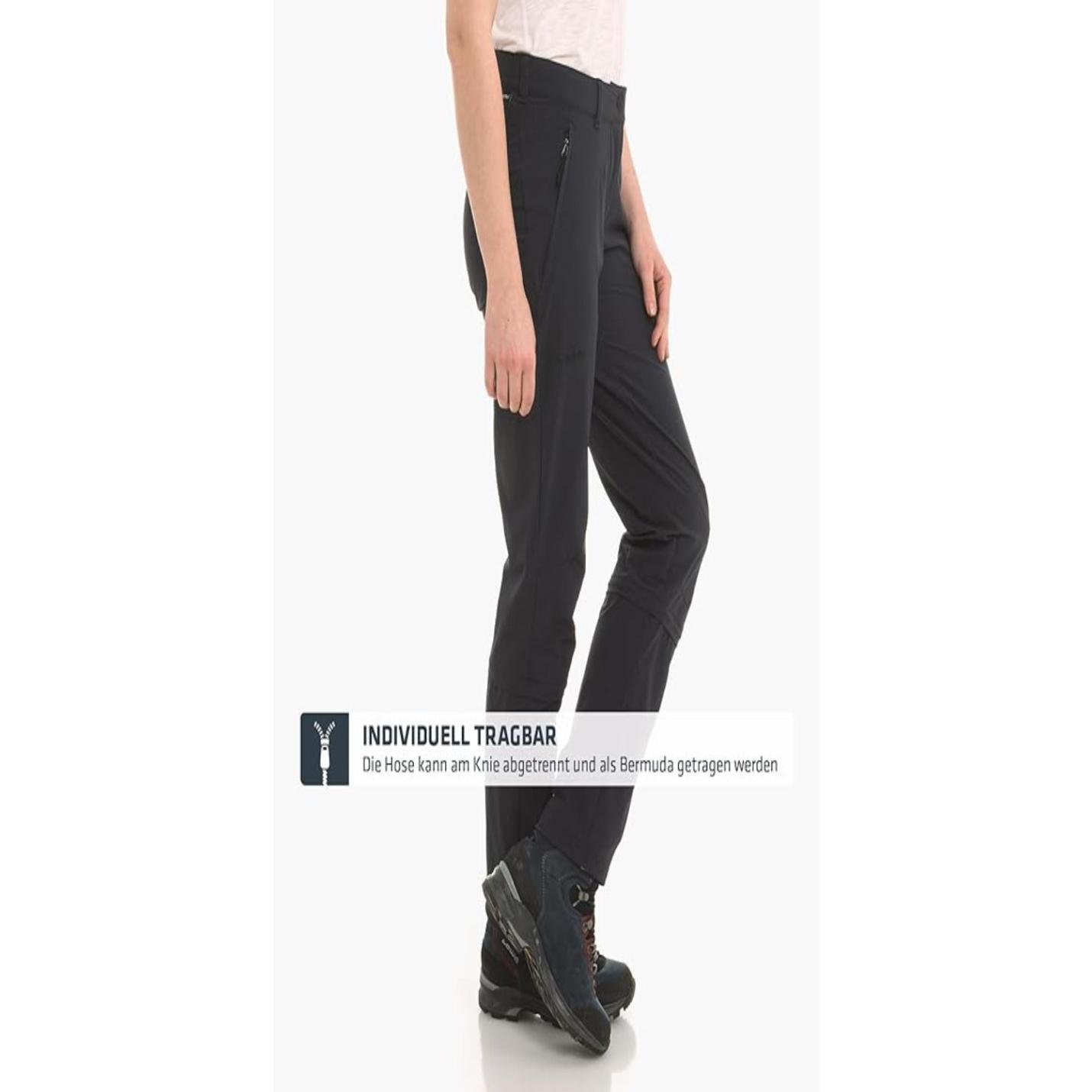 Ontdek de perfecte wandelbroek voor dames - Zwart toont een zwarte converteerbare broek met 4-way stretch die kan worden omgevormd tot een korte broek, gecombineerd met wandelschoenen.